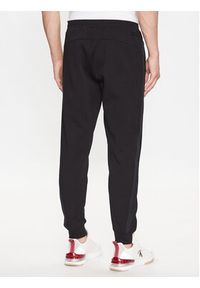 Calvin Klein Spodnie dresowe Logo Tape K10K111565 Czarny Comfort Fit. Kolor: czarny. Materiał: dresówka, bawełna