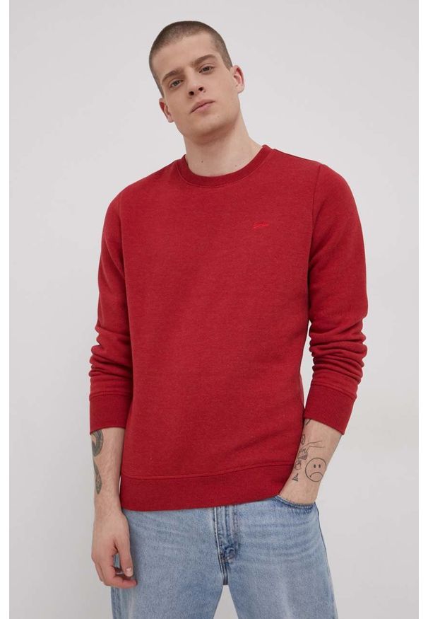 Superdry Bluza męska kolor czerwony gładka. Okazja: na co dzień. Kolor: czerwony. Materiał: dzianina. Wzór: gładki. Styl: casual