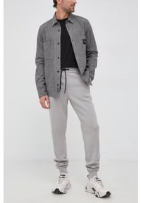 Calvin Klein - Spodnie. Kolor: szary. Materiał: dzianina