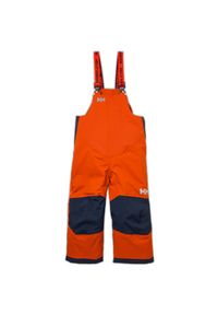 Dziecięcy kombinezon narciarski Helly Hansen rider 2. Kolor: pomarańczowy. Sezon: zima. Sport: narciarstwo #1