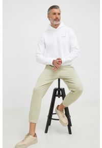 Calvin Klein bluza męska kolor biały z kapturem gładka. Typ kołnierza: kaptur. Kolor: biały. Materiał: włókno. Wzór: gładki