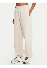 Reebok Spodnie dresowe Reebok X Ewa Chodakowska RK25304CCW Beżowy Regular Fit. Kolor: beżowy. Materiał: bawełna #1