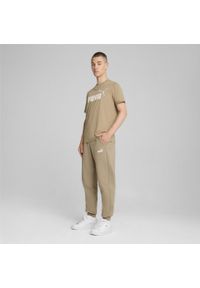 Puma - Spodnie sportowe z dwukolorowym logo męskie PUMA Essentials+. Kolor: beżowy. Materiał: dresówka