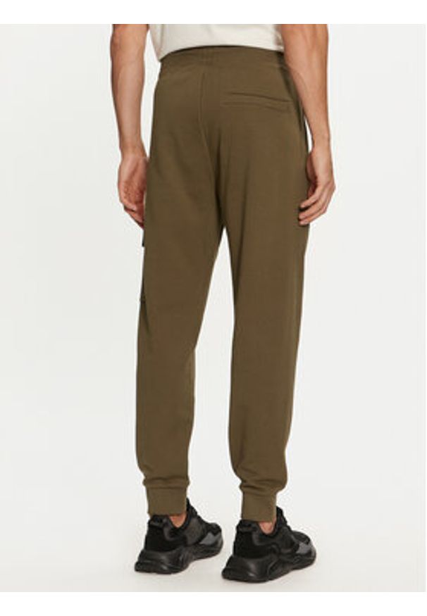 Hugo - HUGO Spodnie dresowe Dwellrom 50479164 Khaki Relaxed Fit. Kolor: brązowy. Materiał: bawełna