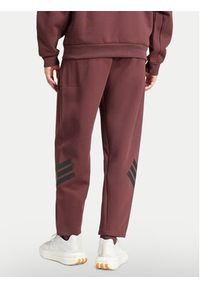 Adidas - adidas Spodnie dresowe Future Icons 3-Stripes JD4888 Bordowy Loose Fit. Kolor: czerwony. Materiał: bawełna