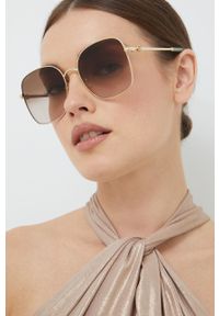 Gucci okulary przeciwsłoneczne damskie kolor złoty. Kolor: złoty. Wzór: geometria