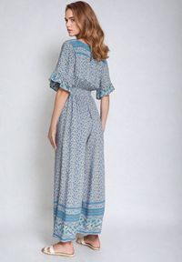 Born2be - Niebieski Bawełniany Kombinezon z Gumkami w Pasie i Kopertowym Dekoltem Zapinany z Tyłu na Guziki Lorrania. Okazja: na co dzień. Kolor: niebieski. Materiał: bawełna. Długość rękawa: krótki rękaw. Długość: krótkie. Styl: elegancki, casual, wizytowy #6