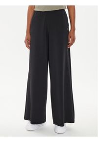 Guess Spodnie dresowe V4YB07 KCAY2 Czarny Relaxed Fit. Kolor: czarny. Materiał: syntetyk #1
