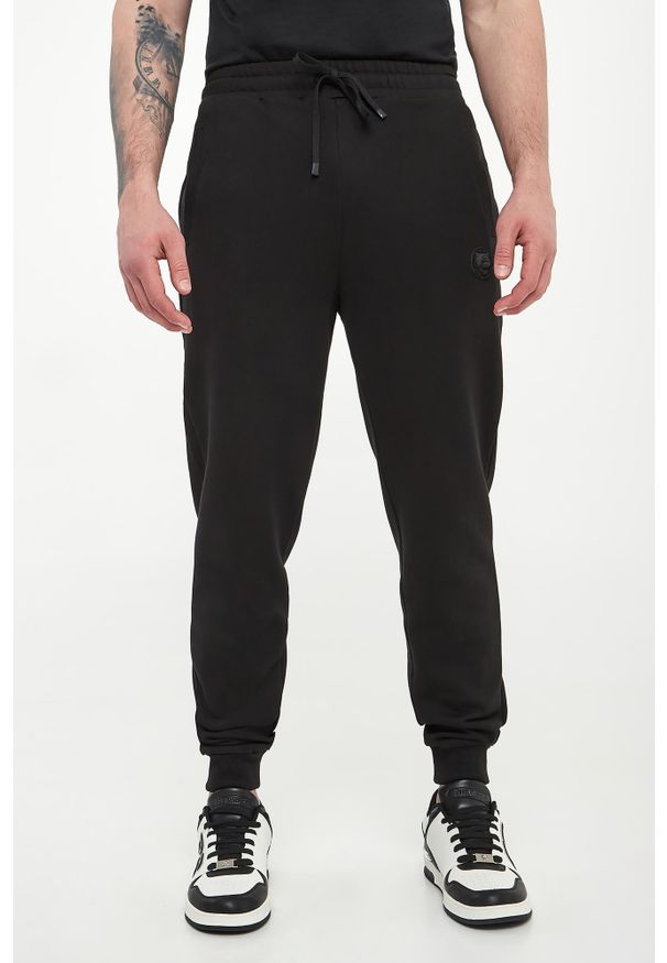 Plein Sport - Spodnie dresowe męskie PLEIN SPORT. Materiał: dresówka