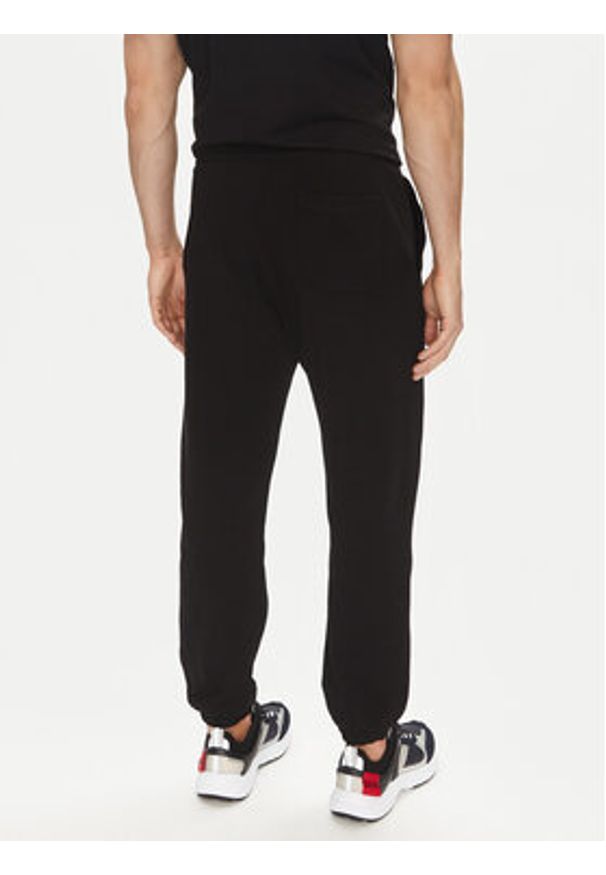 Hugo - HUGO Spodnie dresowe Dusplitan 50542866 Czarny Relaxed Fit. Kolor: czarny. Materiał: bawełna