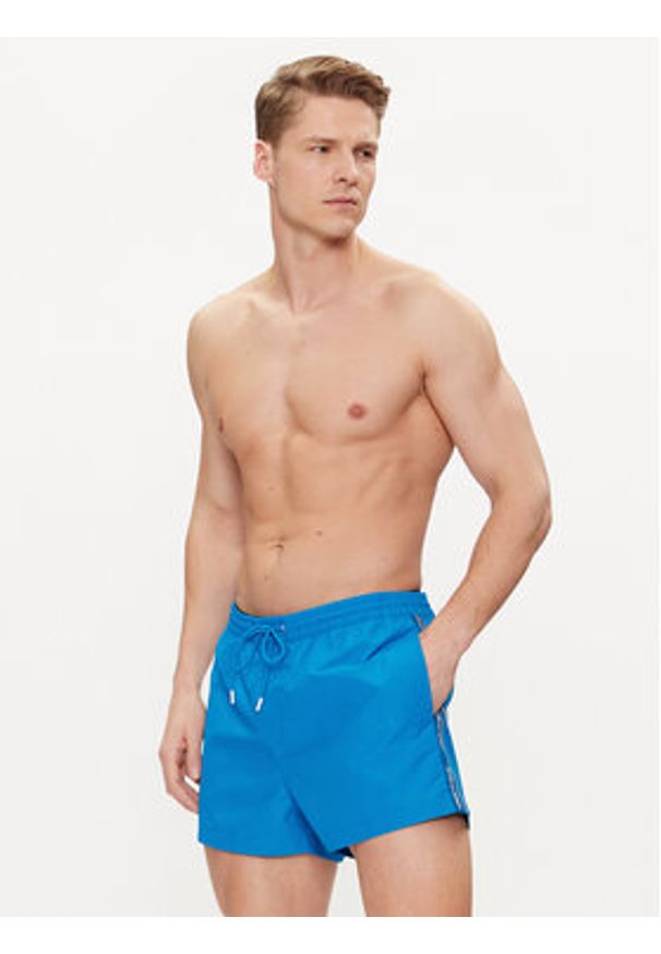 Calvin Klein Swimwear Szorty kąpielowe KM0KM00956 Niebieski Regular Fit. Kolor: niebieski. Materiał: syntetyk