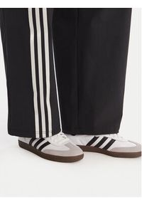 Adidas - adidas Spodnie dresowe Ribbon Parachute JV9727 Czarny Loose Fit. Kolor: czarny. Materiał: syntetyk