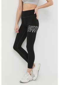 DKNY - Dkny legginsy damskie kolor czarny z nadrukiem. Kolor: czarny. Materiał: skóra. Wzór: nadruk