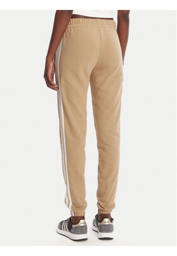 Adidas - adidas Spodnie dresowe Essentials 3-Stripes JX7661 Beżowy Regular Fit. Kolor: beżowy. Materiał: bawełna