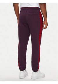 Puma Spodnie dresowe T7 PLAY.PARIS 626768 44 Bordowy Regular Fit. Kolor: czerwony. Materiał: bawełna, materiał