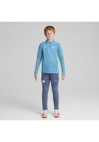 Puma - Młodzieżowa bluza treningowa Manchester City F.C. z zamkiem 1/4 PUMA. Kolor: wielokolorowy, żółty, niebieski