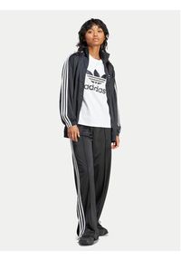Adidas - adidas Spodnie dresowe Firebird IT7404 Czarny Regular Fit. Kolor: czarny. Materiał: syntetyk #3