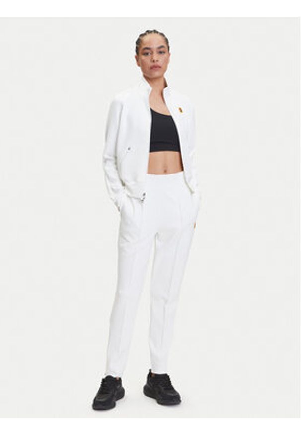 Nike Spodnie dresowe Court DA4722 Biały Slim Fit. Kolor: biały. Materiał: syntetyk