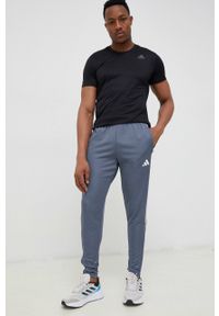 adidas Performance spodnie treningowe Tiro 23 kolor szary z aplikacją. Kolor: szary. Materiał: skóra, dzianina, materiał. Wzór: aplikacja. Sport: fitness #1