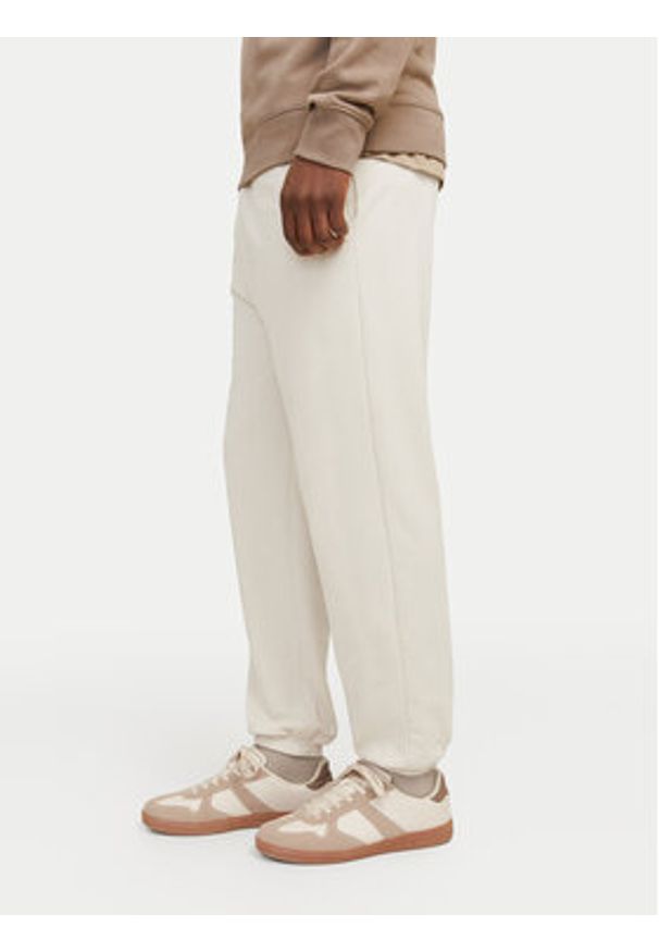 Jack & Jones Spodnie dresowe Morgan 12257964 Beżowy Regular Fit. Kolor: beżowy. Materiał: syntetyk, bawełna
