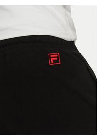 Fila Spodnie dresowe Lagesse FAM0869 Czarny Regular Fit. Kolor: czarny. Materiał: syntetyk