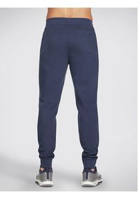 skechers - Skechers Spodnie dresowe Sweats Essential Jogger PT16 Szary Regular Fit. Kolor: szary. Materiał: dresówka, bawełna