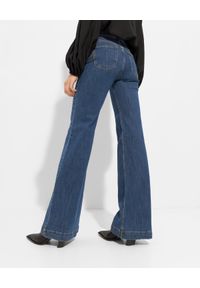 SIMONA CORSELLINI - Jeansowe spodnie dzwony. Stan: podwyższony. Kolor: niebieski. Długość: długie