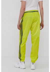 adidas Originals Spodnie dwustronne męskie kolor żółty gładkie. Kolor: żółty. Materiał: poliester. Wzór: gładki #4