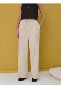 Sinsay - Spodnie palazzo z domieszką lnu - kremowy. Kolor: kremowy. Materiał: len #1