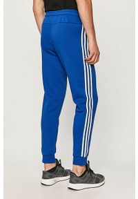 Adidas - adidas - Spodnie. Kolor: niebieski. Materiał: bawełna, poliester, dzianina. Wzór: nadruk, aplikacja #4