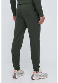 EA7 Emporio Armani spodnie dresowe bawełniane kolor zielony gładkie. Kolor: zielony. Materiał: bawełna, dresówka. Wzór: gładki #3