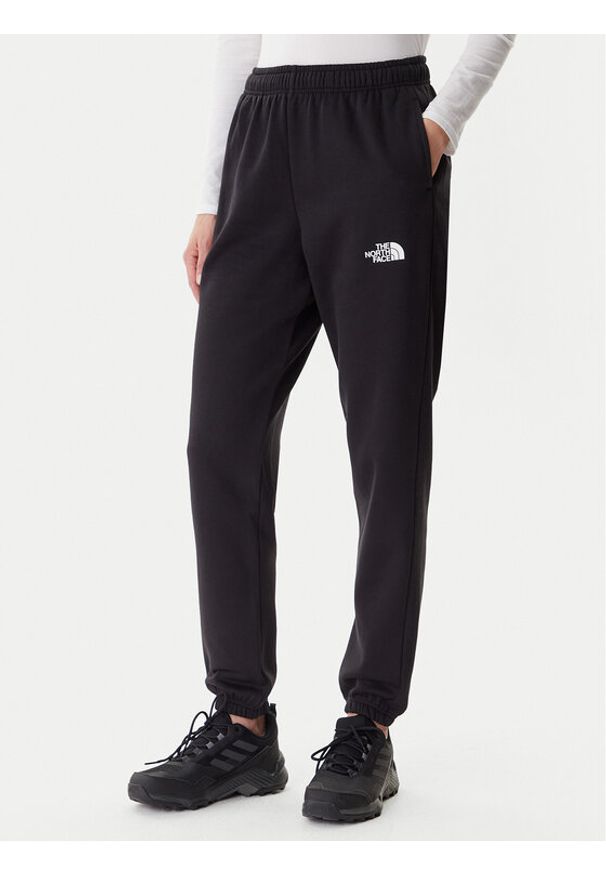 The North Face Spodnie dresowe Simple Dome NF0A8C1Y Czarny Regular Fit. Kolor: czarny. Materiał: syntetyk, bawełna
