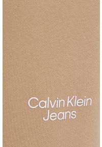 Calvin Klein Jeans spodnie bawełniane damskie kolor beżowy gładkie. Stan: podwyższony. Kolor: beżowy. Materiał: bawełna. Wzór: gładki