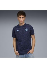 Puma - Męska koszulka Manchester City FtblCulture z nadrukiem na całej powierzchni PUMA. Kolor: niebieski. Wzór: nadruk. Sport: piłka nożna
