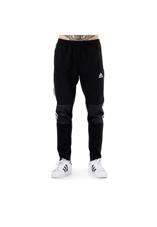Adidas - Spodnie adidas Tiro Winterized H33688 - czarne. Kolor: czarny. Materiał: poliester, materiał, bawełna, dresówka, polar. Wzór: paski, aplikacja. Sport: piłka nożna, fitness
