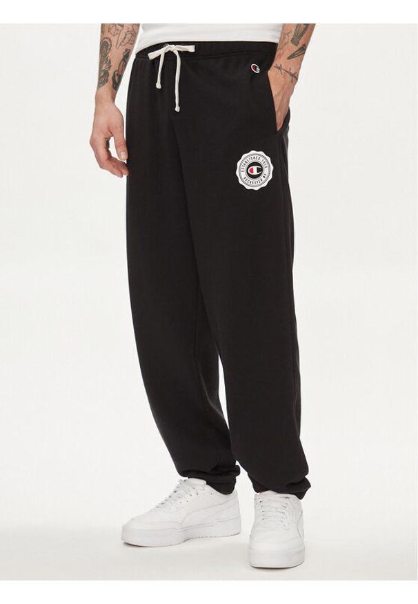 Champion Spodnie dresowe 219849 Czarny Custom Fit. Kolor: czarny. Materiał: syntetyk, bawełna