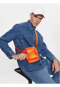 Calvin Klein Jeans Saszetka Ultralight Reporter 18 Nylon K50K509817 Pomarańczowy. Kolor: pomarańczowy. Materiał: materiał #2