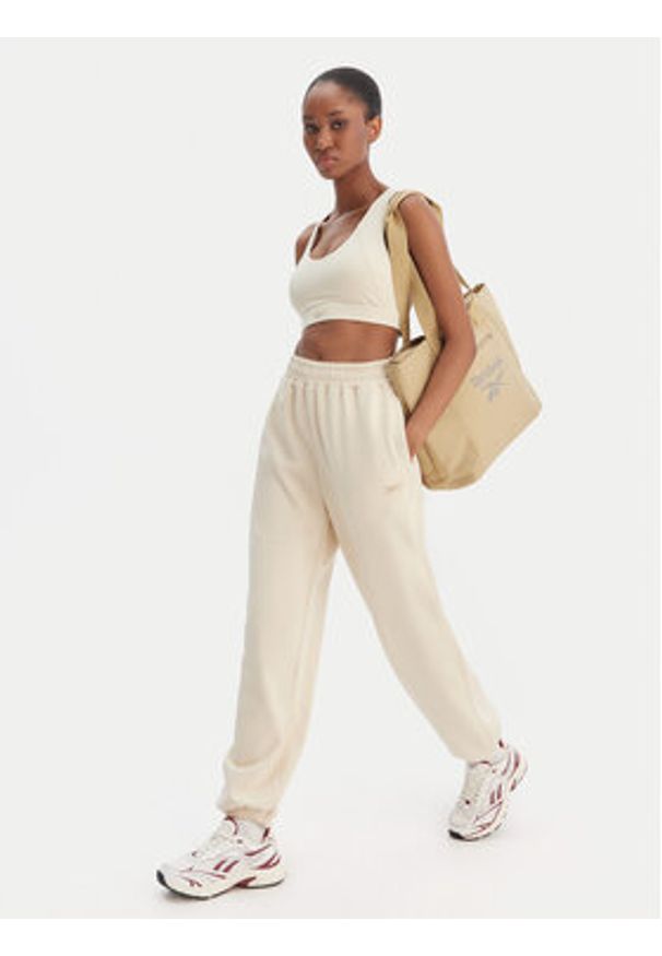 Reebok Spodnie dresowe Reebok x Ewa Chodakowska Ada RK25621CCW Beżowy Relaxed Fit. Kolor: beżowy. Materiał: bawełna