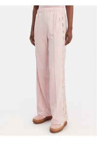 Adidas - adidas Spodnie dresowe Firebird Lace KC6444 Różowy Loose Fit. Kolor: różowy. Materiał: syntetyk, bawełna #1