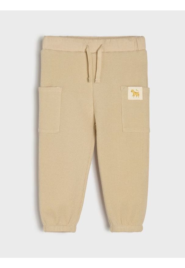 Sinsay - Bawełniane spodnie jogger - brązowy. Kolor: brązowy. Materiał: bawełna