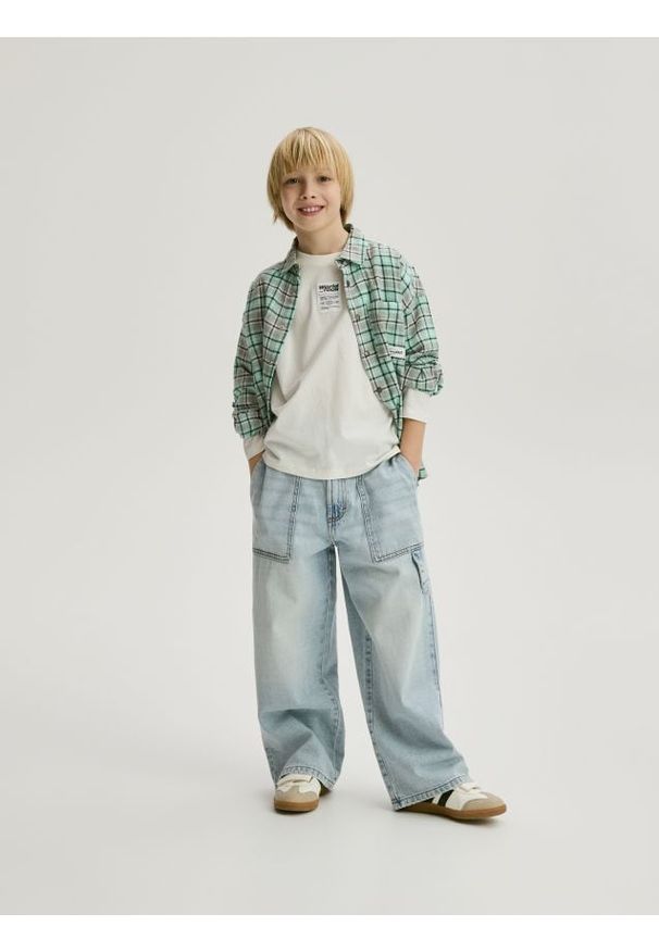 Reserved - Jeansy baggy - niebieski. Kolor: niebieski