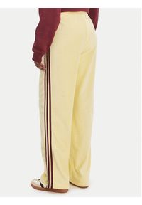 Adidas - adidas Spodnie dresowe Terry Towel Firebird KQ6662 Żółty Loose Fit. Kolor: żółty. Materiał: bawełna #4