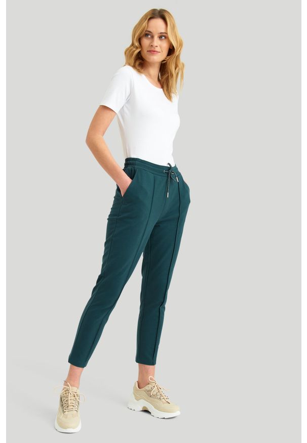 Greenpoint - Dresowe spodnie z ozdobnym przeszyciem, turkus. Materiał: dresówka