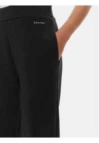 Calvin Klein Spodnie dresowe Nano Logo K20K207214 Czarny Relaxed Fit. Kolor: czarny. Materiał: bawełna #5