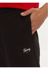 Tommy Jeans Spodnie dresowe Script DW0DW17771 Czarny Relaxed Fit. Kolor: czarny. Materiał: bawełna