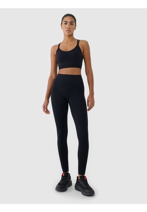 4f - 4F Legginsy treningowe bezszwowe damskie - czarne M/L. Stan: podwyższony. Kolor: czarny. Materiał: materiał, dzianina, syntetyk, włókno, elastan. Wzór: gładki, jednolity, ze splotem. Sport: fitness