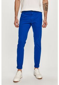 Tommy Jeans - Spodnie. Kolor: niebieski. Materiał: tkanina, bawełna, elastan. Wzór: gładki #1