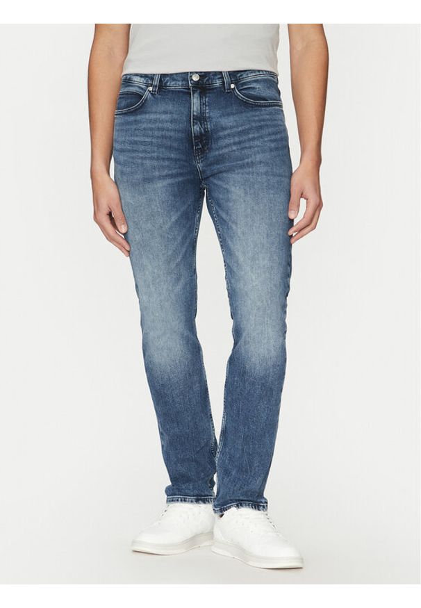 Hugo - HUGO Jeansy 50530587 Niebieski Slim Fit. Kolor: niebieski