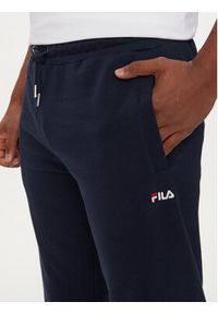 Fila Spodnie dresowe FAM0342 Granatowy Regular Fit. Kolor: niebieski. Materiał: bawełna #5