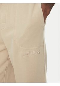 Guess Spodnie dresowe U5RB00 KCO31 Beżowy Regular Fit. Kolor: beżowy. Materiał: bawełna #4
